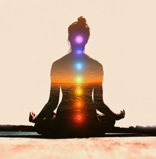 Meditating figure with chakra points